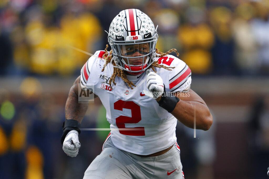 Paul Sancya FILE - In this Nov. 30, 2019, file photo, Ohio State defensive end Chase Young watches a play develop during the second half of the team' NCAA college football game against Michigan in Ann Arbor, Mich. Chase led the nation in sacks with 16 1-2 and forced fumbles with six last season, finishing fourth in the Heisman Trophy voting. (AP Photo/Paul Sancya, File)