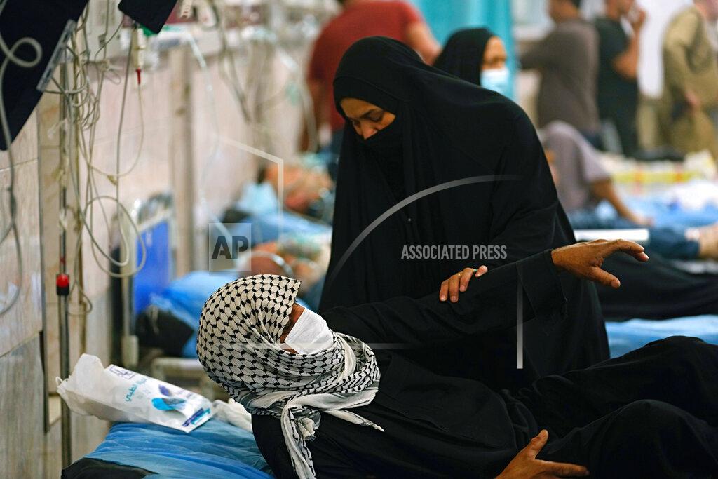 Hadi Mizban People with breathing problems are treated at a hospital during a sandstorm in Baghdad, Iraq, Monday, May 23, 2022. (AP Photo/Hadi Mizban)