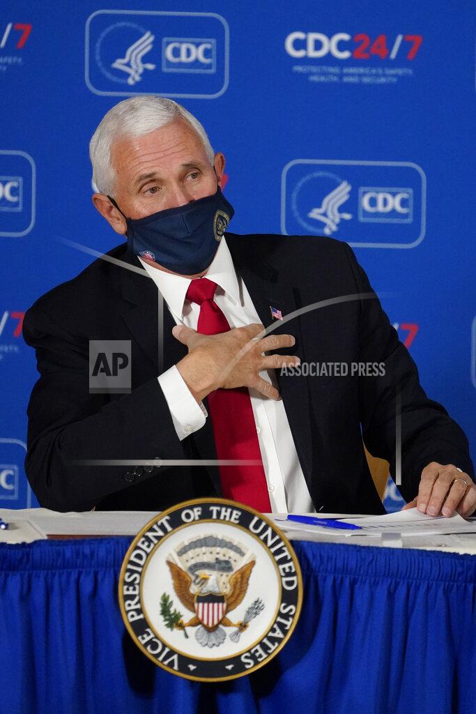 John Bazemore Vice President Mike Pence speaks during a briefing on COVID-19 at the Centers for Disease Control and Prevention Friday, Dec. 4, 2020, in Atlanta. (AP Photo/John Bazemore)