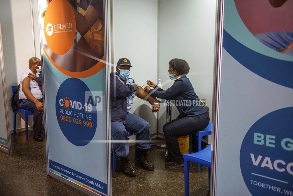 Alet Pretorius FILE - In this July 5 2021, file photo a policeman receives his Johnson & Johnson COVID-19 vaccine in Soweto, South Africa. South Africa's COVID-19 vaccination campaign is regaining momentum after being disrupted earlier this month by a week of riots following the imprisonment of former President Jacob Zuma. (AP Photo/Alet Pretorius, File)