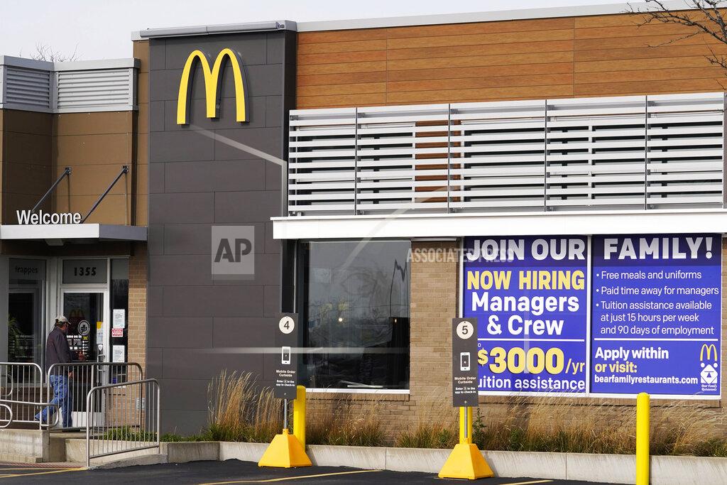 FILE - In this Nov. 19, 2020, file photo, a hiring sign is displayed outside of McDonald's in Buffalo Grove, Ill. On Wednesday, April 14, 2021, McDonald’s said the company will mandate worker training to combat harassment, discrimination and violence in its restaurants worldwide starting in 2022. (AP Photo/Nam Y. Huh, File)
