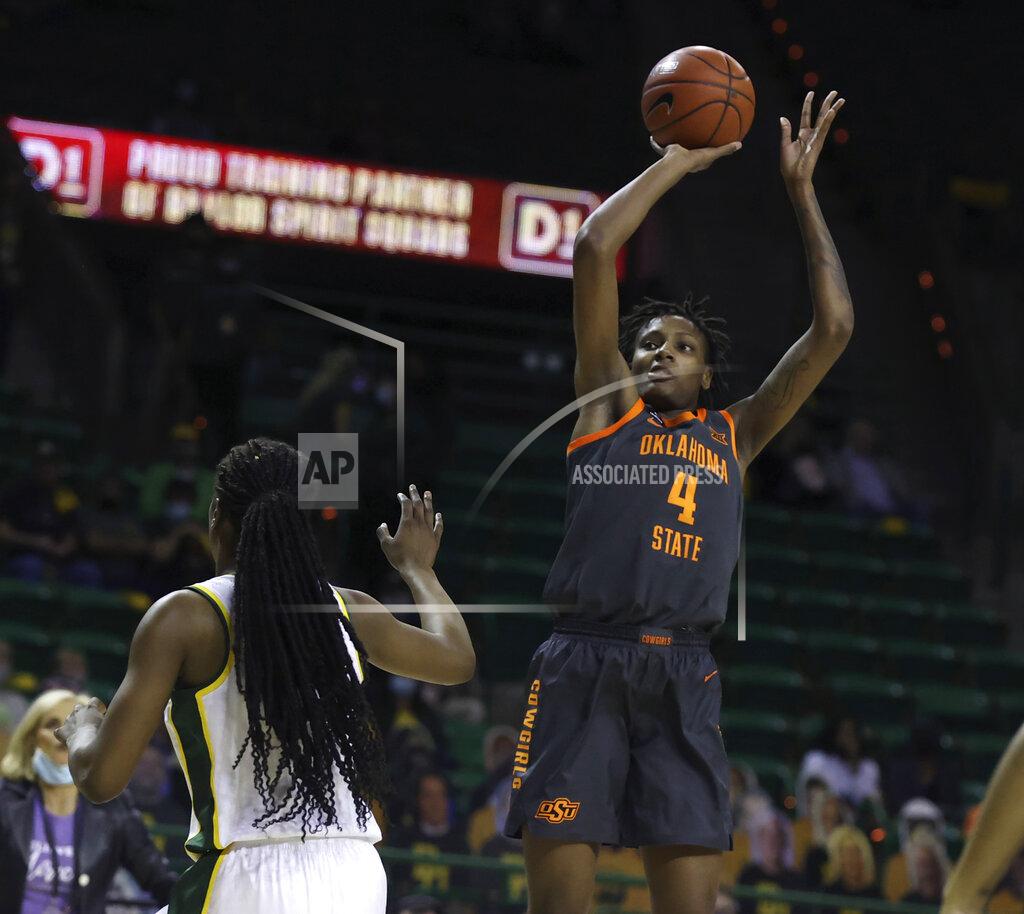 Rod Aydelotte Oklahoma State forward Natasha Mack, right, scores over Baylor center Queen Egbo, left, during the first half of an NCAA college basketball game, Wednesday, Feb. 24, 2021, in Waco, Texas. (Rod Aydelotte/Waco Tribune-Herald via AP)