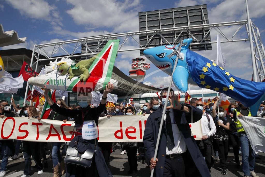 Alessandra Tarantino Alitalia workers stage a protest at the Rome Leonardo da Vinci airport as unions are discussing with the government the future to relaunch the Italian airline carrier Alitalia, Friday, April 23, 2021. (AP Photo/Alessandra Tarantino)