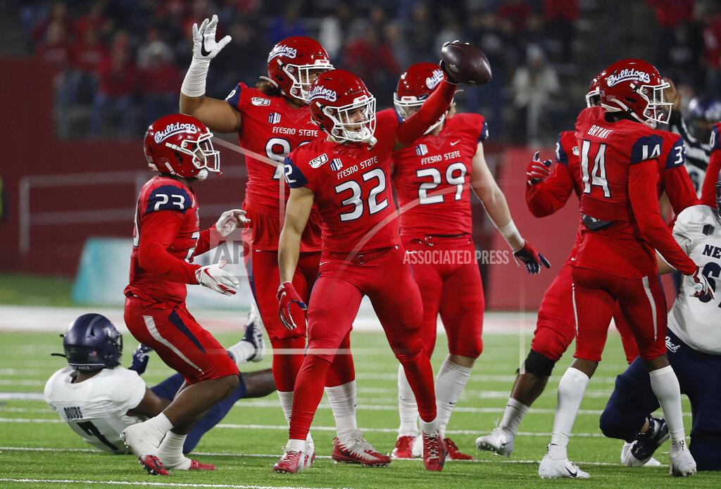 Gary Kazanjian Fresno State defensive back Evan Williams holds up the ball after a fumble by Nevada during the first half of an NCAA college football game in Fresno, Calif., Saturday, Nov. 23, 2019. (AP Photo/Gary Kazanjian)