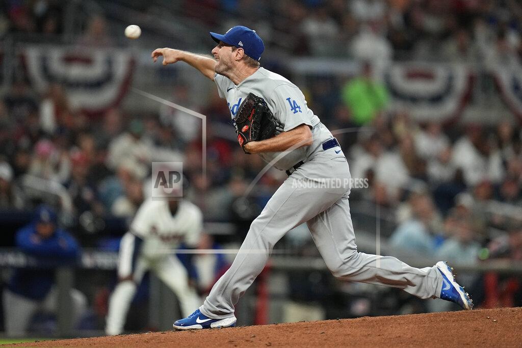 Ashley Landis Los Angeles Dodgers starting pitcher Max Scherzer throws during the first inning against the Atlanta Braves in Game 2 of baseball's National League Championship Series Sunday, Oct. 17, 2021, in Atlanta. (AP Photo/Ashley Landis)