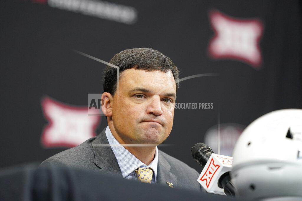 Lm Otero West Virginia head coach Neal Brown listens to a reporter's question at the NCAA college football Big 12 media days in Arlington, Texas, Wednesday, July 13, 2022. (AP Photo/LM Otero)