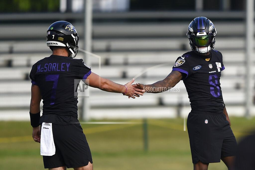 Gail Burton Baltimore Ravens quarterback Lamar Jackson, right, greets Trace McSorley during an NFL football practice, Monday, Aug. 9, 2021 in Owings Mills, Md.(AP Photo/Gail Burton)
