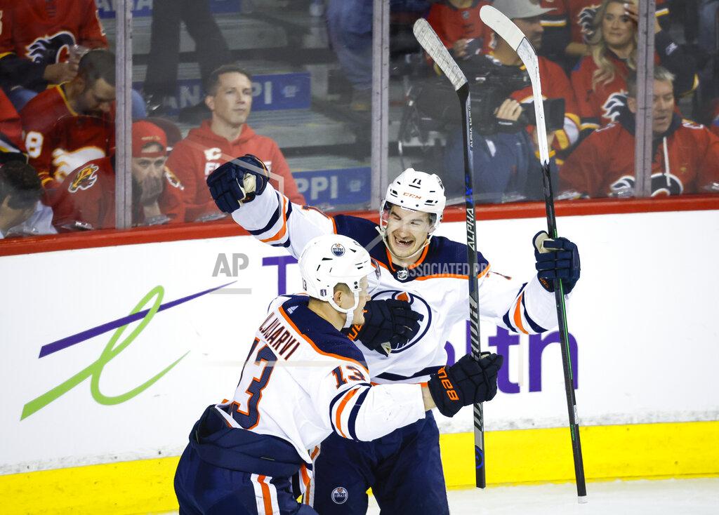 Jeff Mcintosh Edmonton Oilers winger Jesse Puljujarvi, left, celebrates his goal against the Calgary Flames with center Ryan McLeod during the second period of Game 5 of an NHL hockey second-round playoff series Thursday, May 26, 2022, in Calgary, Alberta. (Jeff McIntosh/The Canadian Press via AP)