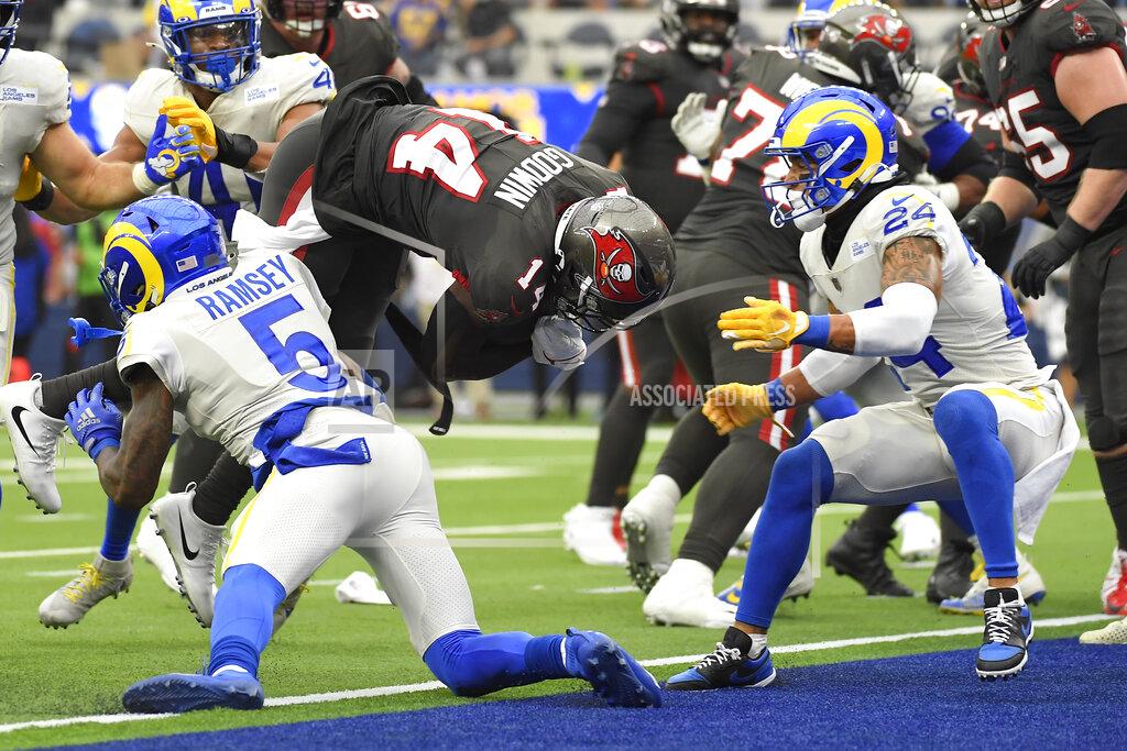 Kevork Djansezian Tampa Bay Buccaneers wide receiver Chris Godwin, top center, scores a touchdown over Los Angeles Rams cornerback Jalen Ramsey (5) during the first half of an NFL football game Sunday, Sept. 26, 2021, in Inglewood, Calif. (AP Photo/Kevork Djansezian)