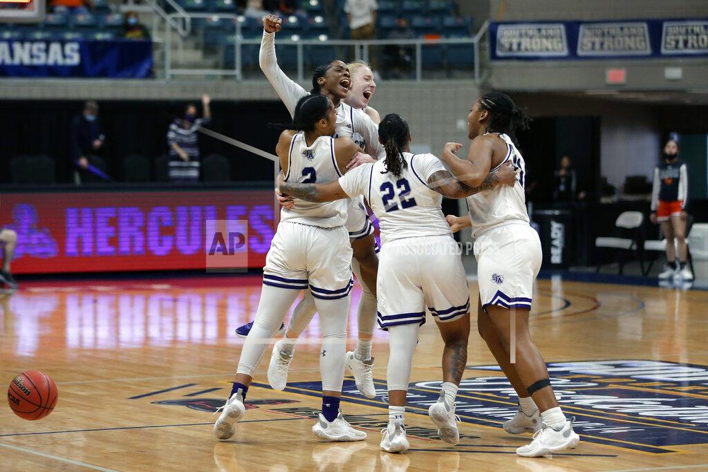 Michael Wyke Stephen F. Austin players celebrate on the court after the final buzzer of their win over Sam Houston State after an NCAA college basketball game for the Southland Conference women's tournament championship Sunday, March 14, 2021, in Katy, Texas. (AP Photo/Michael Wyke)