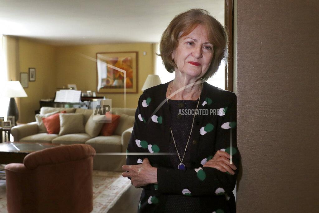 Charles Rex Arbogast Senior U.S. District Judge Joan Lefkow, poses Monday, July 27, 2020, for a portrait in her Chicago home. In 2005, Lefkow returned from work to find her husband and mother shot dead in the basement of her Chicago home. Lefkow was forced to relive her family tragedy this month when a struggling lawyer armed with a gun and a grudge opened fire at the home of another female judge. (AP Photo/Charles Rex Arbogast)