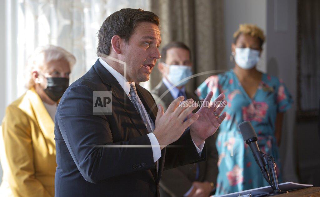 John Pendygraft FILE - In this Sept. 25, 2020, file photo, Florida Gov. Ron DeSantis announces the state's phase three openings at a news conference in St. Petersburg, Fla. As the summer coronavirus spike in Sunbelt states subsides, Florida has gone the furthest in lifting restrictions, especially on restaurants where the burden of ensuring safety has shifted to business owners and residents _ raising concerns of a resurgence. (John Pendygraft/Tampa Bay Times via AP, File)