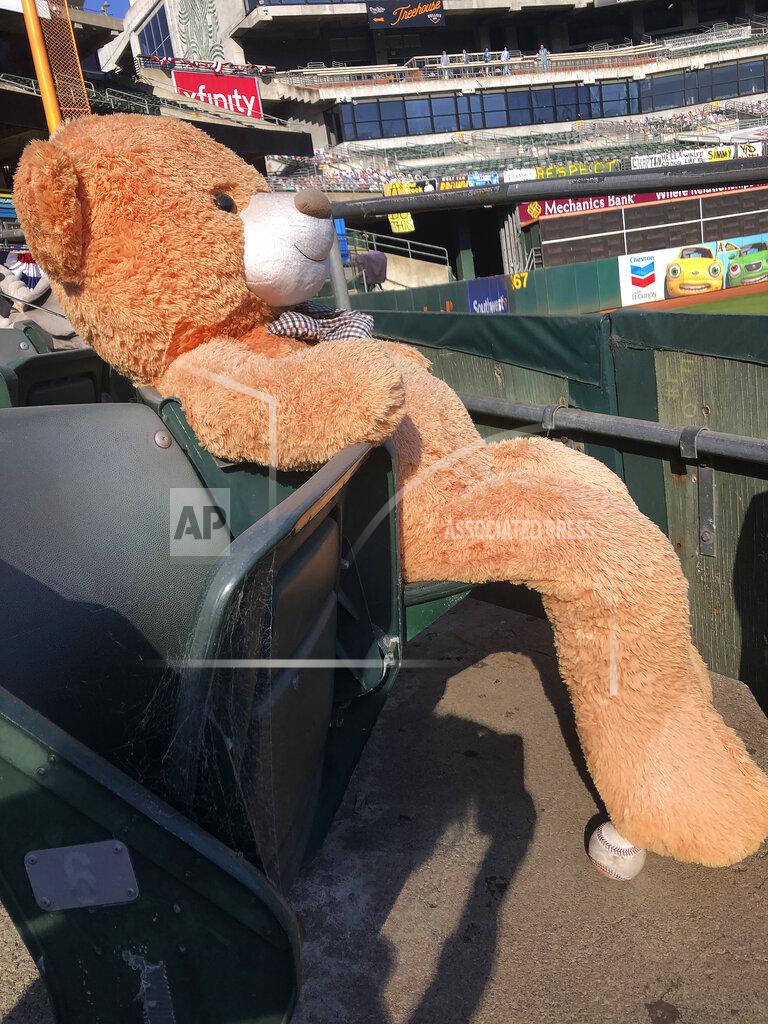 Janie Mccauley A baseball sits below a stuffed bear seated at Oakland Coliseum after Game 1 of an American League wild-card baseball series between the Oakland Athletics and the Chicago White Sox, Tuesday, Sept. 29, 2020, in Oakland, Calif. (AP Photo/Janie McCauley)