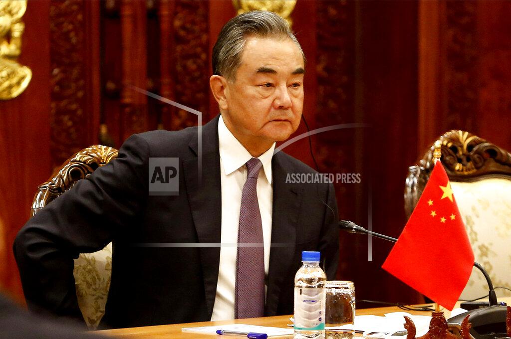 Kith Serey Chinese Foreign Minister Wang Yi listens to his Cambodian counterpart Prak Sokhonn during a meeting in Phnom Penh, Cambodia, Sunday, Sept. 12, 2021. Wang is visiting Cambodia, where's he expected to meet with Prime Minister Hun Sen and other officials to discuss COVID-19 and other regional issues. (Kith Serey/Photo Photo via AP)