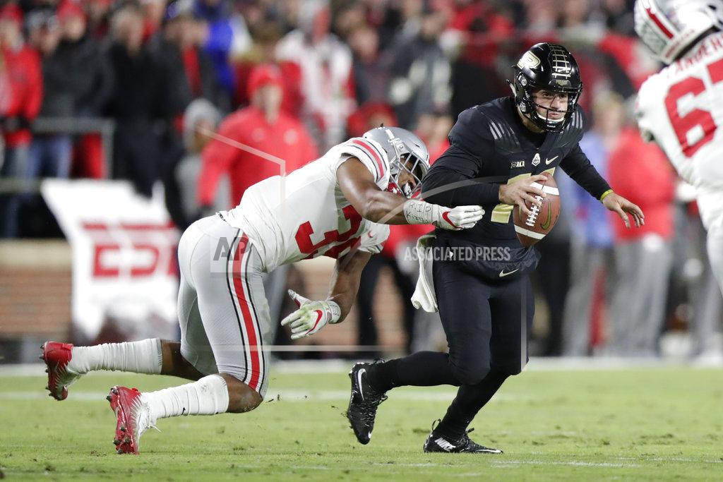 Michael Conroy Ohio State linebacker Malik Harrison (39) sacks Purdue quarterback David Blough (11) during the first half of an NCAA college football game in West Lafayette, Ind., Saturday, Oct. 20, 2018. (AP Photo/Michael Conroy)