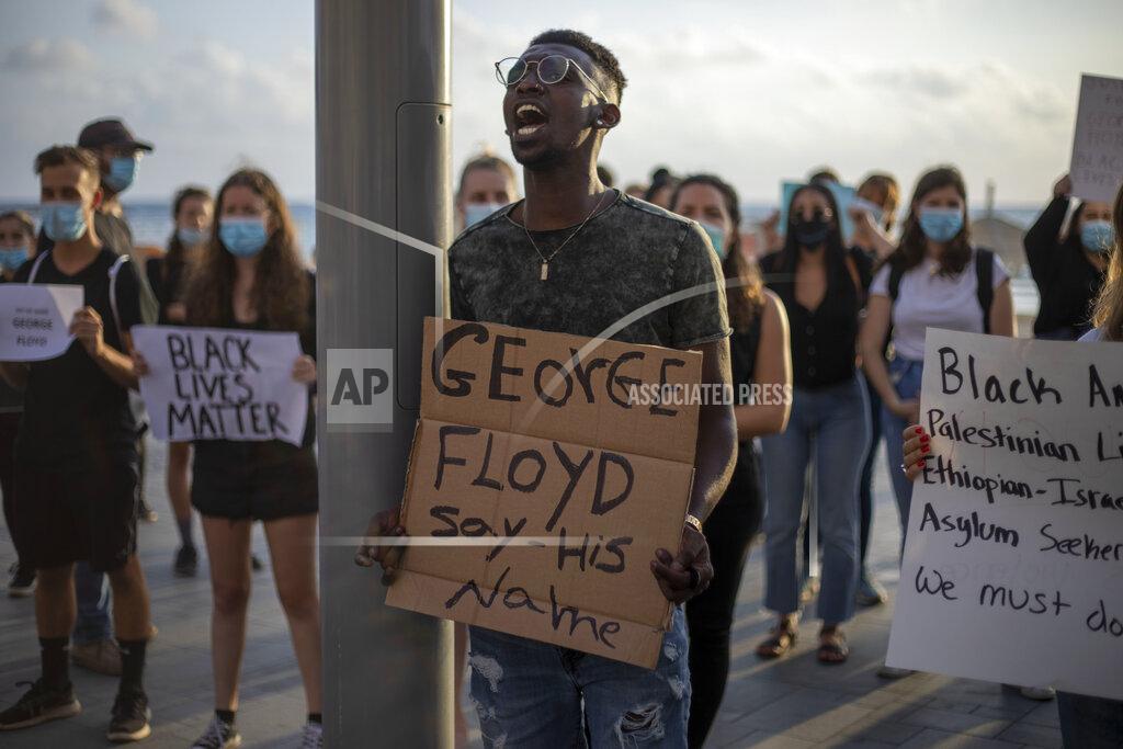 Ariel Schalit Protesters shout slogans during a protest to decry the killing of George Floyd in front of the American embassy in Tel Aviv, Israel, Tuesday, June 2, 2020. (AP Photo/Ariel Schalit)