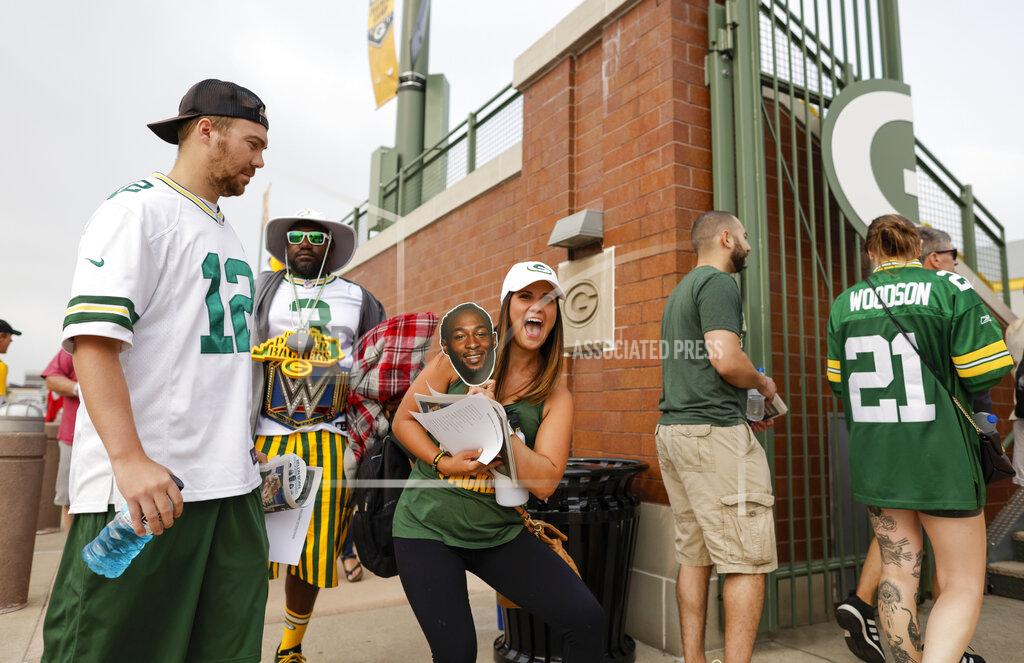 Matt Ludtke Green Bay Packers' fans make their way to NFL football training camp Saturday, July 31, 2021, in Green Bay, Wis. (AP Photo/Matt Ludtke)