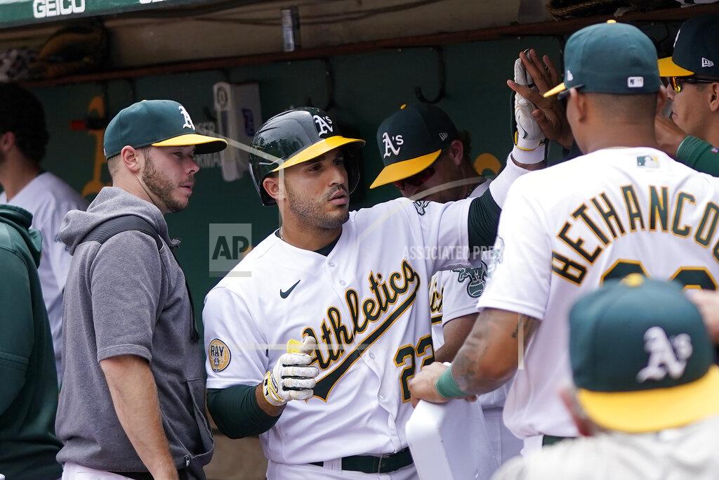 Jeff Chiu Oakland Athletics' Ramon Laureano, middle, is congratulated by teammates after hitting a home run against the Toronto Blue Jays during the sixth inning of a baseball game in Oakland, Calif., Wednesday, July 6, 2022. (AP Photo/Jeff Chiu)