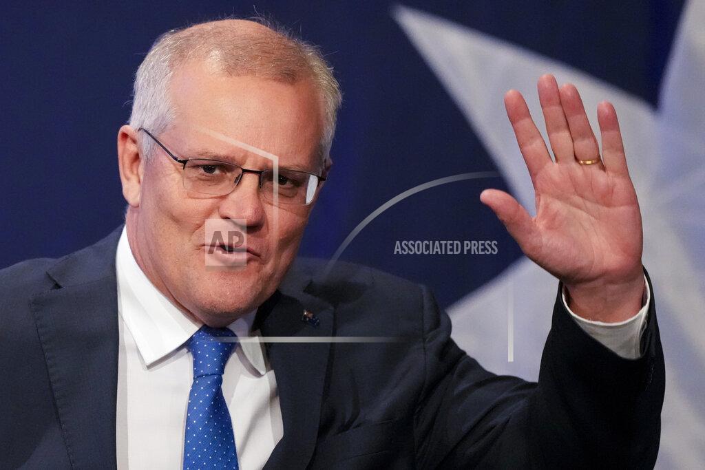 Mark Baker Australian Prime Minister Scott Morrison waves as he arrives at a Liberal Party function in Sydney, Australia, Saturday, May 21, 2022. Morrison has conceded defeat and has confirmed that he would hand over the leadership of the Liberal Party following his party's loss to Labor's in today's federal election. (AP Photo/Mark Baker)