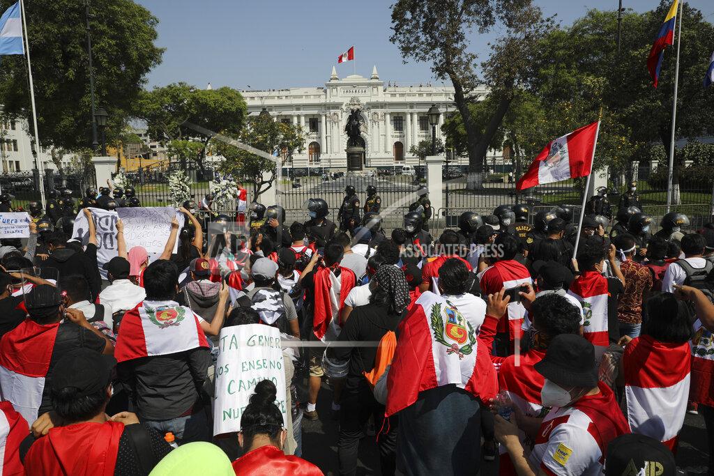 Rodrigo Abd Protesters gather outside Congress in Lima, Peru, Sunday, Nov. 15, 2020, after interim President Manuel Merino announced his resignation following massive protests unleashed when lawmakers ousted President Martin Vizcarra. (AP Photo/Rodrigo Abd)