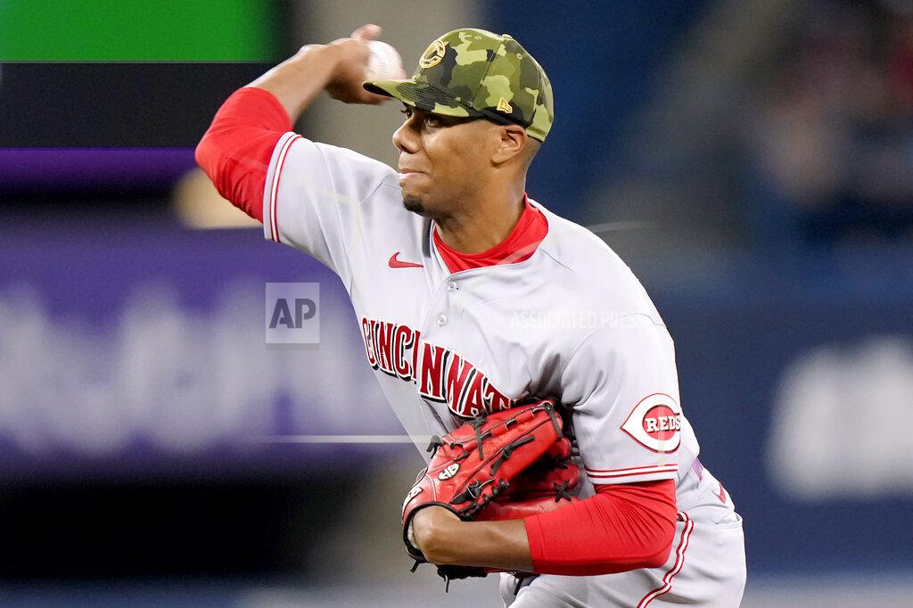 Frank Gunn Cincinnati Reds starting pitcher Hunter Greene (21) works against the Toronto Blue Jays during the first inning of a baseball game in Toronto, Saturday, May 21, 2022. (Frank Gunn/The Canadian Press via AP)