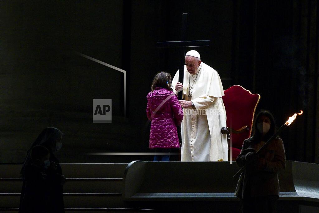 Angelo Carconi Pope Francis leads the Via Crucis (Way of the Cross) procession in the empty square outside the Saint Peter's Basilica during Good Friday celebrations at the Vatican, with no public participation due to the Coronavirus pandemic, Friday, April 2, 2021. (Angelo Carconi/Pool photo via AP)