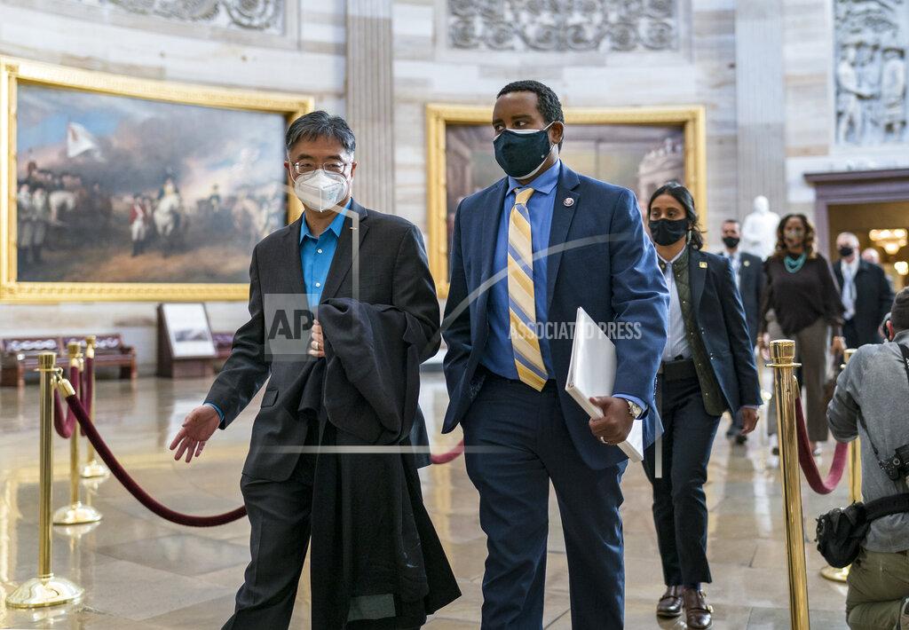 J. Scott Applewhite On the eve of the second impeachment trial of former President Donald Trump, Rep. Ted Lieu, D-Calif., left, Rep. Joe Neguse, D-Colo., center, and other Democratic House impeachment managers walk through the Rotunda after preparing for the case in the Senate, at the Capitol in Washington, Monday, Feb. 8, 2021. The trial will begin Tuesday with a debate and vote on whether it's even constitutional to prosecute the former president, an argument that could resonate with Republicans keen on voting to acquit Trump. (AP Photo/J. Scott Applewhite)