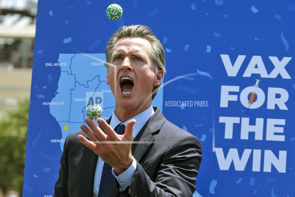 Ringo H.w. Chiu California Gov. Gavin Newsom juggles balls with winning numbers after the Vax for the Win lottery contest during a news conference at Universal Studios in Universal City, Calif., Tuesday, June 15, 2021. On Tuesday, California lifted most of its COVID-19 restrictions and ushered in what has been billed as the state’s “Grand Reopening.” (AP Photo/Ringo H.W. Chiu)