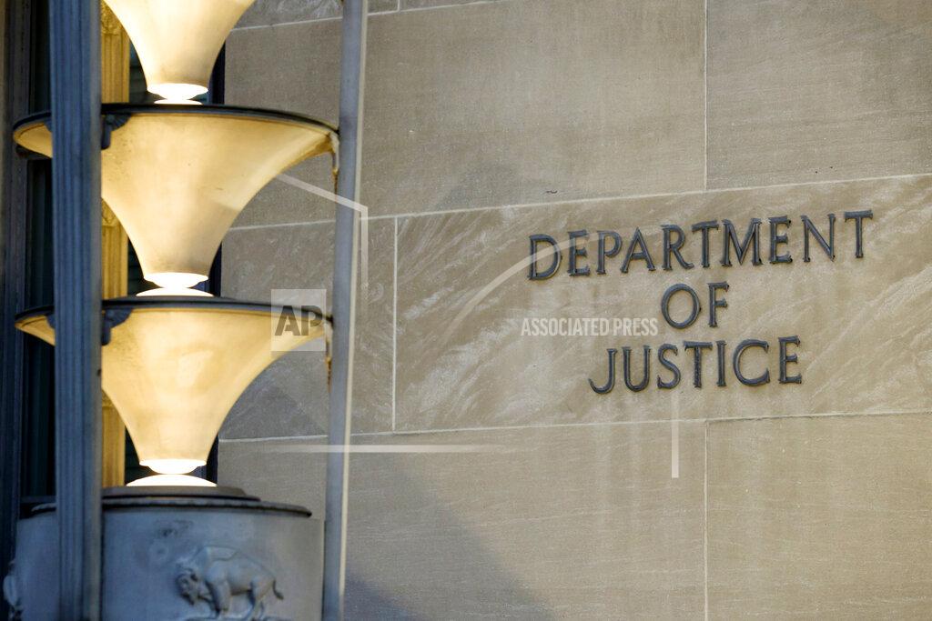 Alex Brandon The Department of Justice is seen, Friday, March 22, 2019, in Washington. The Justice Department under former President Donald Trump secretly seized data from the accounts of at least two Democratic lawmakers in 2018 as part of an aggressive crackdown on leaks related to the Russia investigation and other national security matters, according to three people familiar with the seizures. (AP Photo/Alex Brandon)