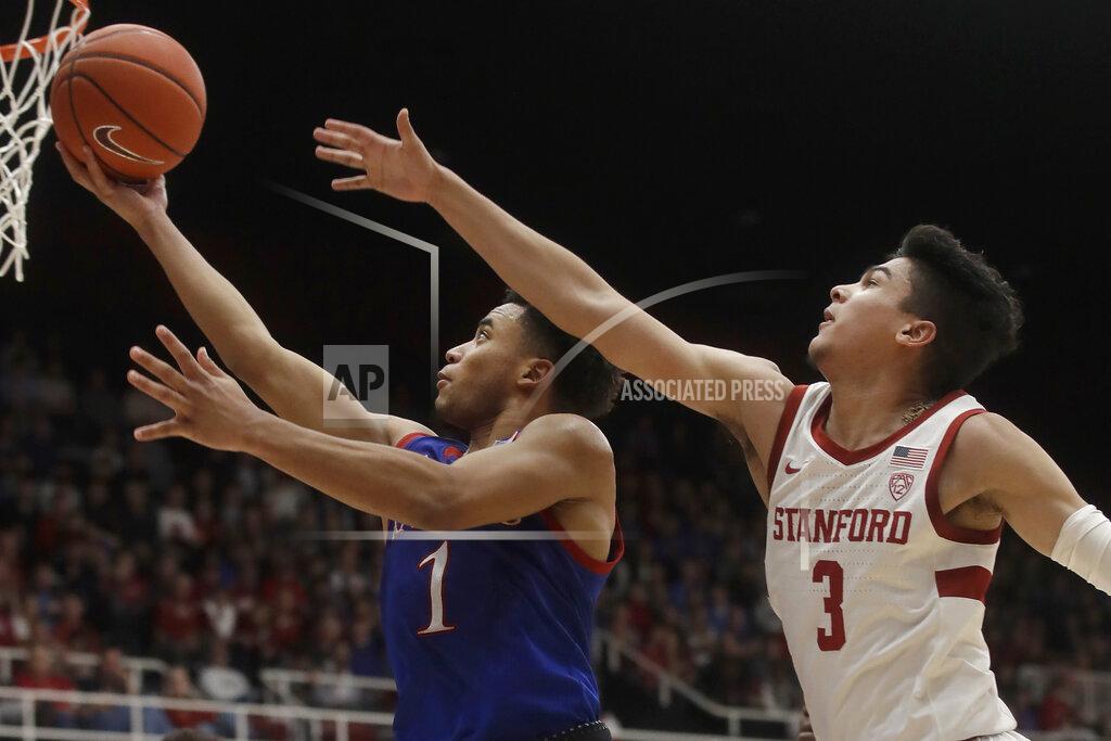Jeff Chiu Kansas guard Devon Dotson (1) shoots against Stanford guard Tyrell Terry (3) during the second half of an NCAA college basketball game in Stanford, Calif., Sunday, Dec. 29, 2019. (AP Photo/Jeff Chiu)
