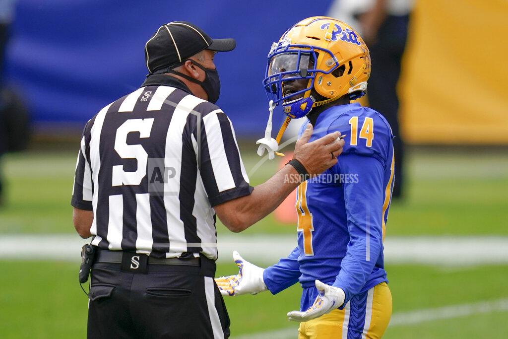 Keith Srakocic FILE - In this Saturday, Oct,. 3, 2020, file photo, Pittsburgh Panthers defensive back Jason Pinnock (15) talks with official Jim Corpora after a pass interference penalty in the first half of an NCAA college football game against North Carolina State, in Pittsburgh. N.C. State beat Pitt 30-29. Pitt entered October unbeaten. Reality has come quickly. (AP Photo/Keith Srakocic, File)