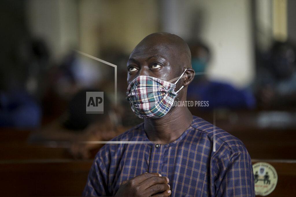 Sunday Alamba A churchgoer wears a face mask to curb the spread of the coronavirus during a Sunday mass at the Holy Cross Cathedral in Lagos, Nigeria Sunday, Aug. 30, 2020. The COVID-19 pandemic is testing the patience of some religious leaders across Africa who worry they will lose followers, and funding, as restrictions on gatherings continue. (AP Photo/Sunday Alamba)