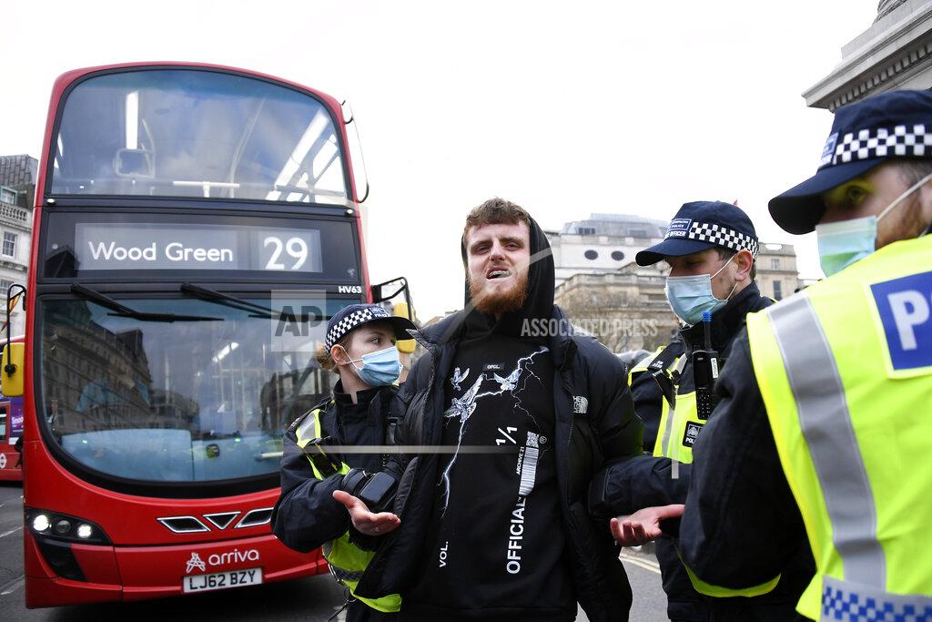 Alberto Pezzali Police restrain a demonstrator during a 'Kill the Bill' protest in London, Saturday, April 3, 2021. The demonstration is against the contentious Police, Crime, Sentencing and Courts Bill, which is currently going through Parliament and would give police stronger powers to restrict protests. (AP Photo/Alberto Pezzali)