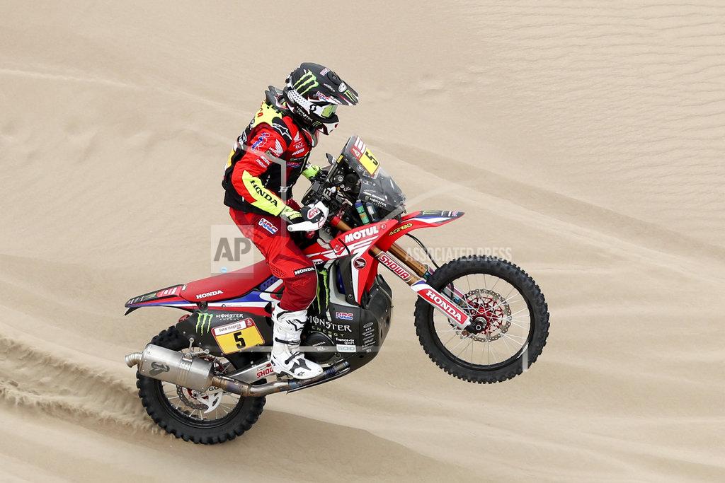 Ricardo Mazalan Joan Barreda of Spain rides his Honda motorbike during the first stage of the Dakar Rally between Lima and Pisco, Peru, Monday, Jan. 7, 2019. (AP Photo/Ricardo Mazalan)
