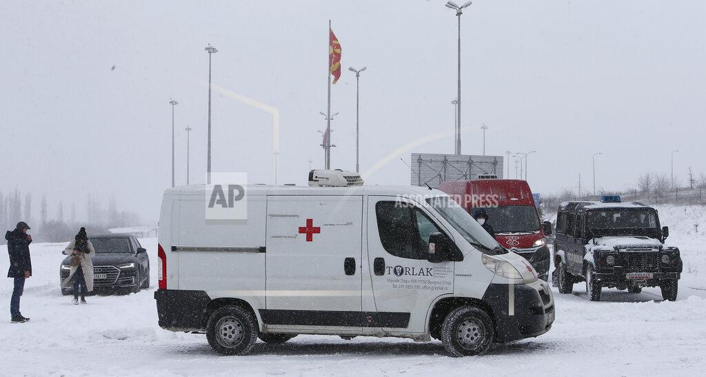 Boris Grdanoski A van with a shipment of COVID-19 vaccines arrives at Tabanovce border crossing between Serbia and North Macedonia, on Sunday, Feb. 14, 2021. Serbia which has launched a successful vaccination campaign has donated some 8,000 doses of Pfizer COVID-19 shots to North Macedonia which is yet to deliver its first shots. (AP Photo/Boris Grdanoski)
