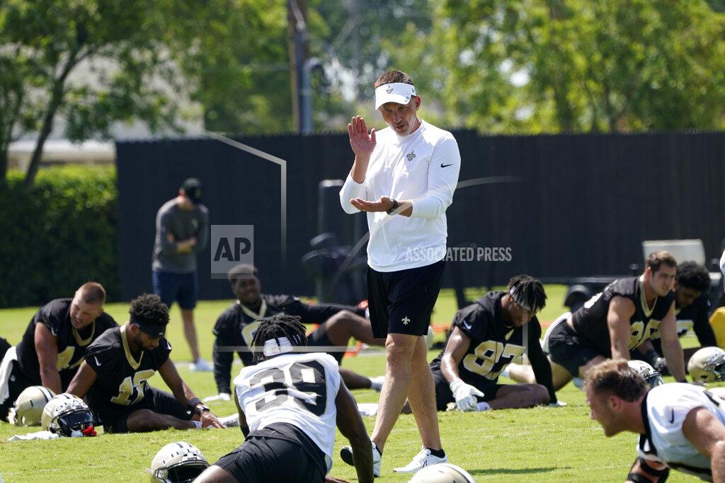 Gerald Herbert New Orleans Saints head coach Dennis Allen talks to running back DaMarcus Fields (39) as they warm up during an NFL football practice in Metairie, La., Thursday, June 2, 2022. (AP Photo/Gerald Herbert)