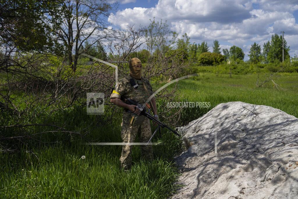 Bernat Armangue A Ukrainian serviceman secures a position in the village of Vilkhivka, on the outskirts of Kharkiv, in eastern Ukraine, Friday, May 20, 2022. (AP Photo/Bernat Armangue)