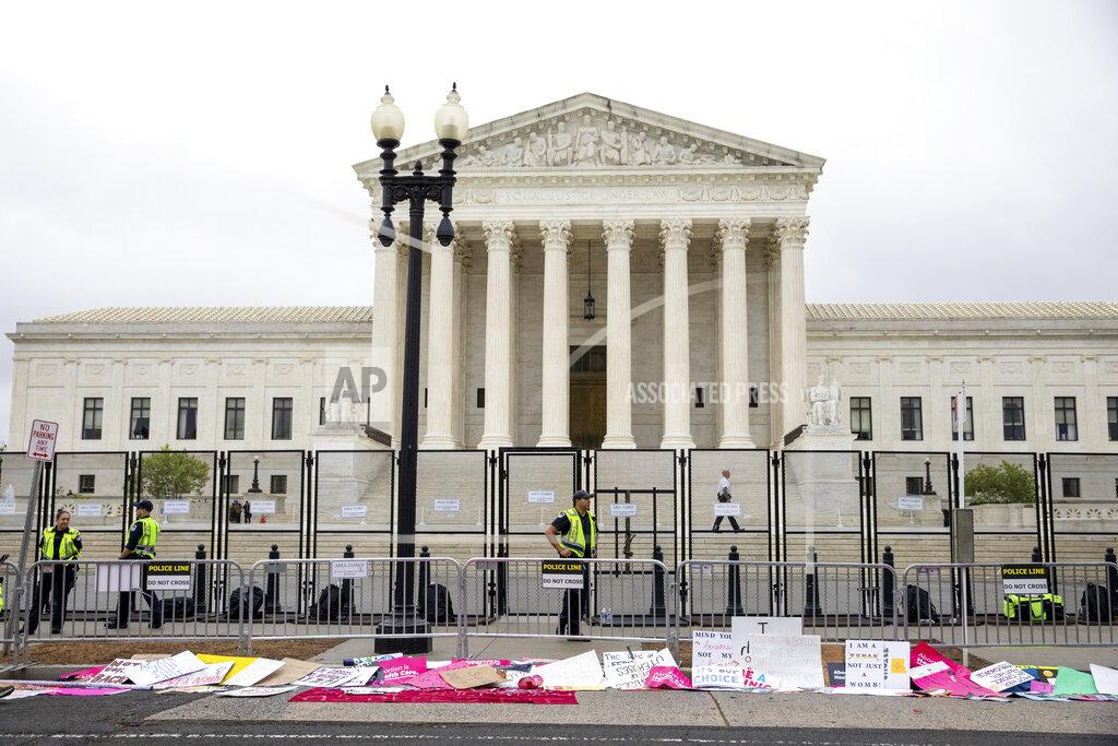 Amanda Andrade-Rhoades Signs lay in front of fencing during a rally for for abortion rights in front of the Supreme Court of the United States in Washington, Saturday, May 14, 2022, during protests across the country. (AP Photo/Amanda Andrade-Rhoades)