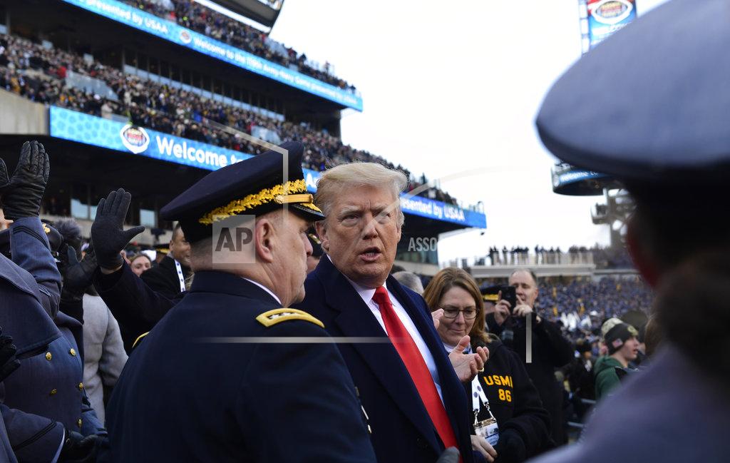 Susan Walsh President Donald Trump, center right, talks with Army Chief of Staff Gen. Mark Milley, center left, during the Army-Navy NCAA college football game in Philadelphia, Saturday, Dec. 8, 2018. Trump announced that Milley will be the next chairman of the Joint Chiefs of Staff. (AP Photo/Susan Walsh)