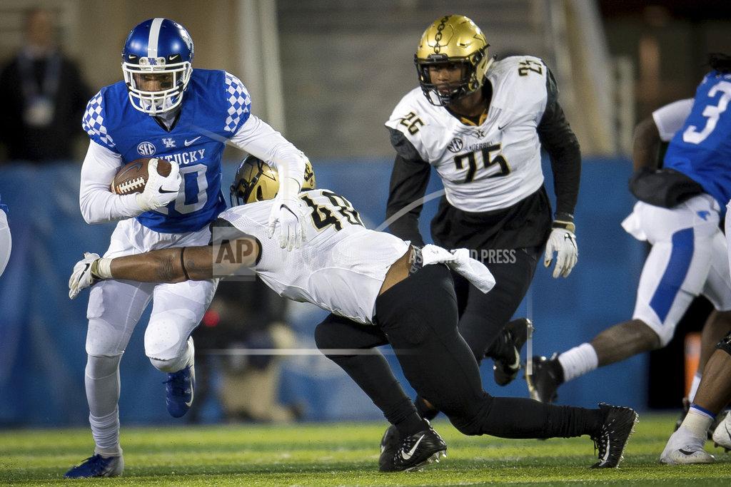 Bryan Woolston Kentucky running back Asim Rose (10) is tackled by Vanderbilt linebacker Jordan Griffin (40) during the second half of an NCAA college football game in Lexington, Ky., Saturday, Oct. 20, 2018. Kentucky won, 14-7. (AP Photo/Bryan Woolston)