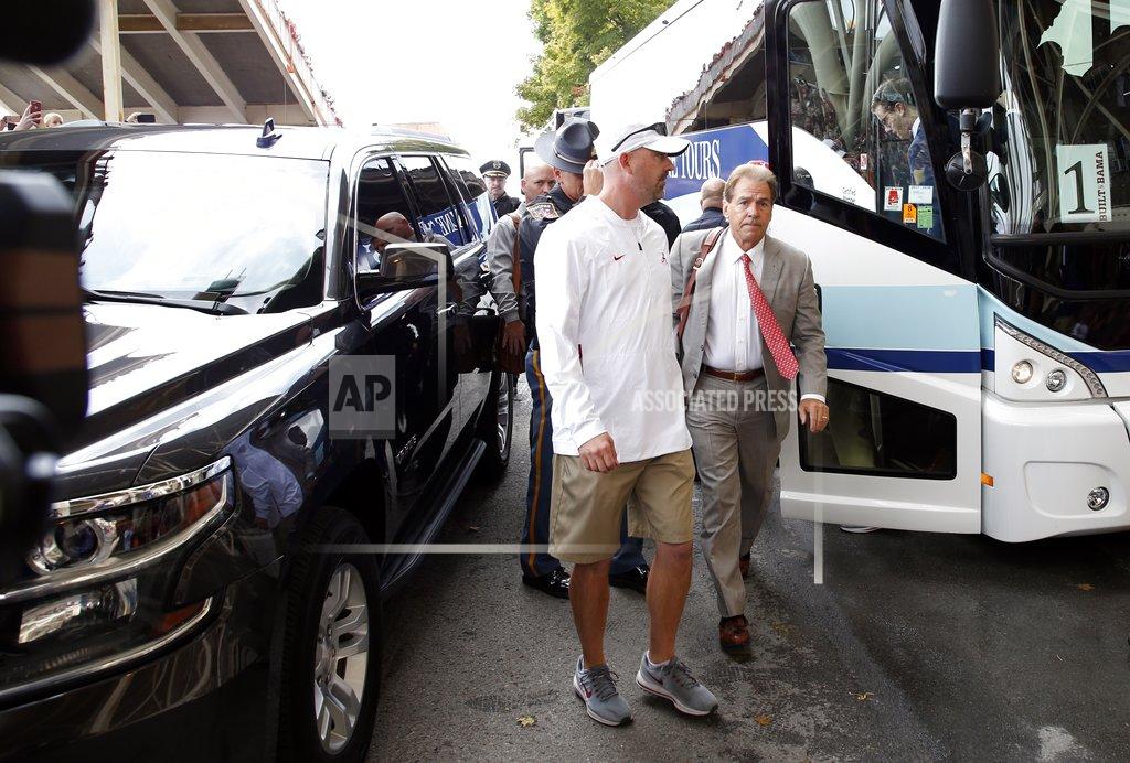 Wade Payne Alabama head coach Nick Saban, right, arrives before an NCAA college football game against Tennessee Saturday, Oct. 20, 2018, in Knoxville, Tenn. (AP Photo/Wade Payne)