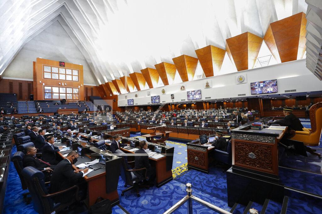 Vincent Thian Malaysia's members of parliament attend a session of the lower house of parliament in Kuala Lumpur, Malaysia, Monday, July 13, 2020. (AP Photo/Vincent Thian)