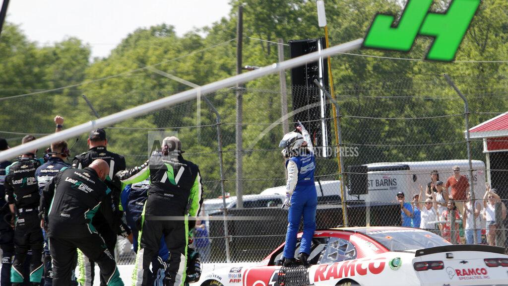 Tom E. Puskar A.J. Allmendinger celebrates on the track after winning the B&L Transport 170 NASCAR Xfinity Series auto race at Mid-Ohio Sports Car Course on Saturday, June 5, 2021, in Lexington, Ohio. (AP Photo/Tom E. Puskar)