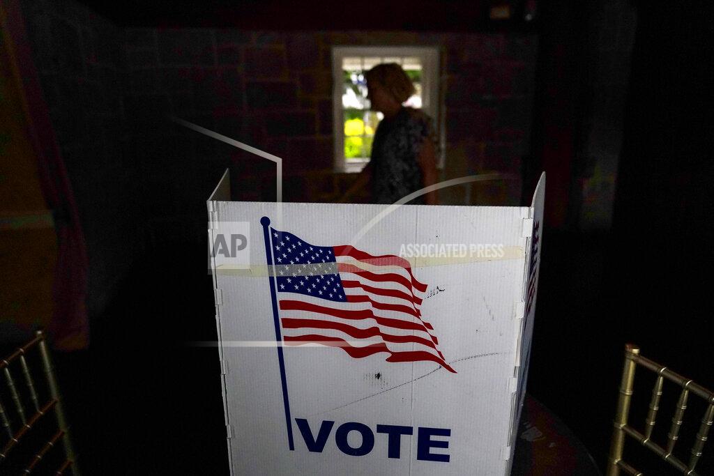 Brynn Anderson A person waits in line to vote in the Georgia's primary election on Tuesday, May 24, 2022, in Atlanta. (AP Photo/Brynn Anderson)