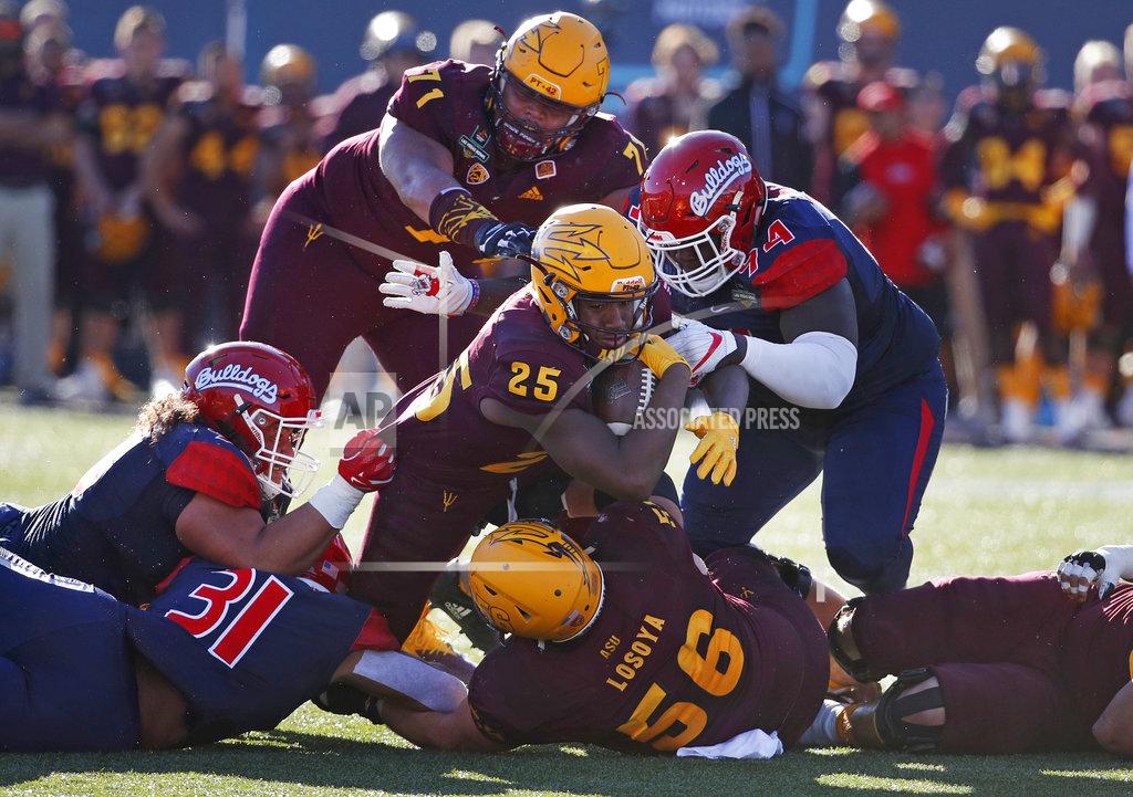 John Locher Arizona State A.J. Carter runs for a gain against Fresno State during the first half of the Las Vegas Bowl NCAA college football game, Saturday, Dec. 15, 2018, in Las Vegas. (AP Photo/John Locher)
