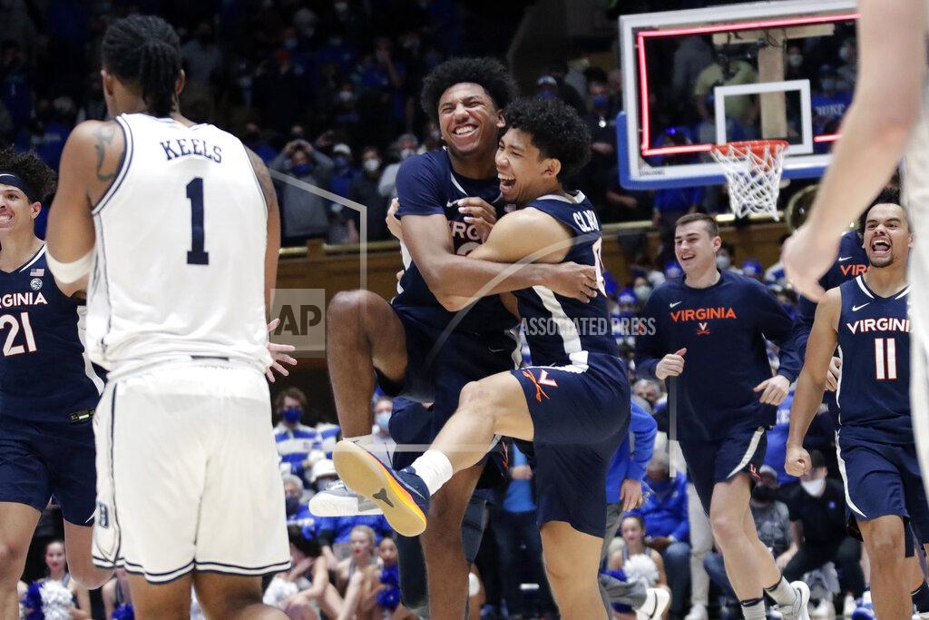 Chris Seward Virginia guard Reece Beekman, center left, celebrates with guard Kihei Clark (0) while Duke guard Trevor Keels (1) looks on as the clock runs out at the end of an NCAA college basketball game against Duke, Monday, Feb. 7, 2022, in Durham, N.C. Beekman hit a 3-point shot with under three seconds for the go-ahead and eventual game-winning points. (AP Photo/Chris Seward)