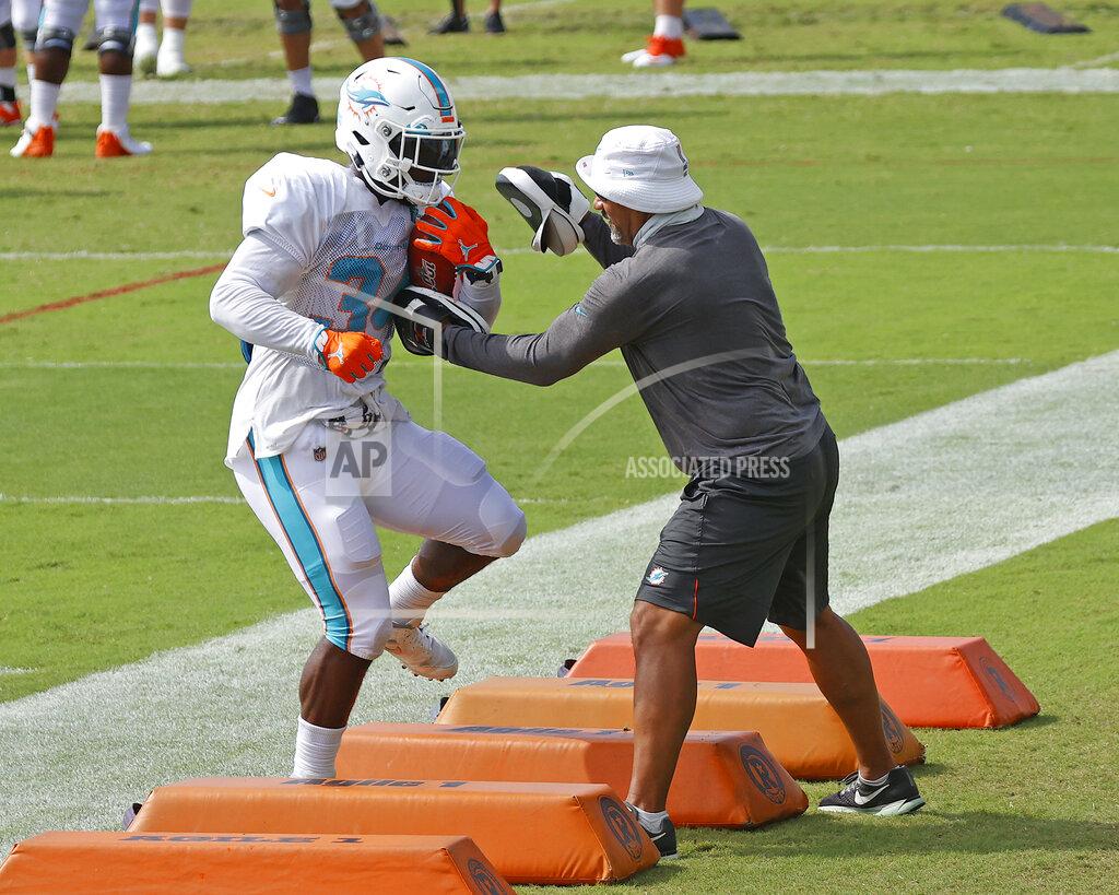 Joel Auerbach Miami Dolphins running back Jordan Howard (34) runs a drill during an NFL football training camp practice in Davie, Fla., Monday, Aug. 17, 2020. (AP Photo/Joel Auerbach)