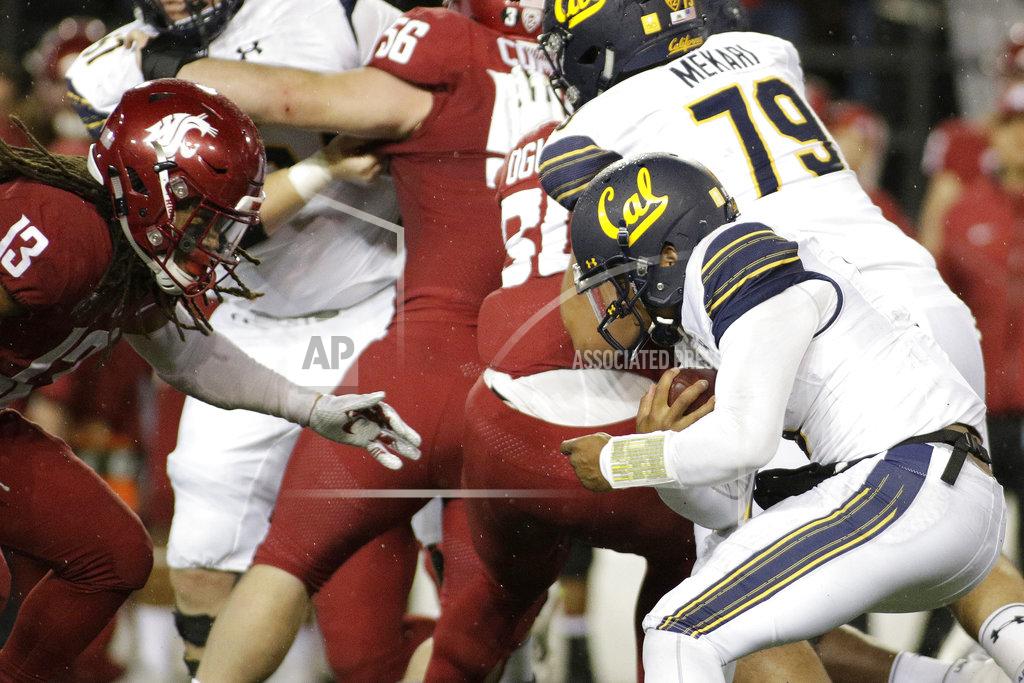 Young Kwak California quarterback Brandon McIlwain, right, runs with the ball while defended by Washington State linebacker Jahad Woods (13) during the second half of an NCAA college football game in Pullman, Wash., Saturday, Nov. 3, 2018. Washington State won 19-13. (AP Photo/Young Kwak)