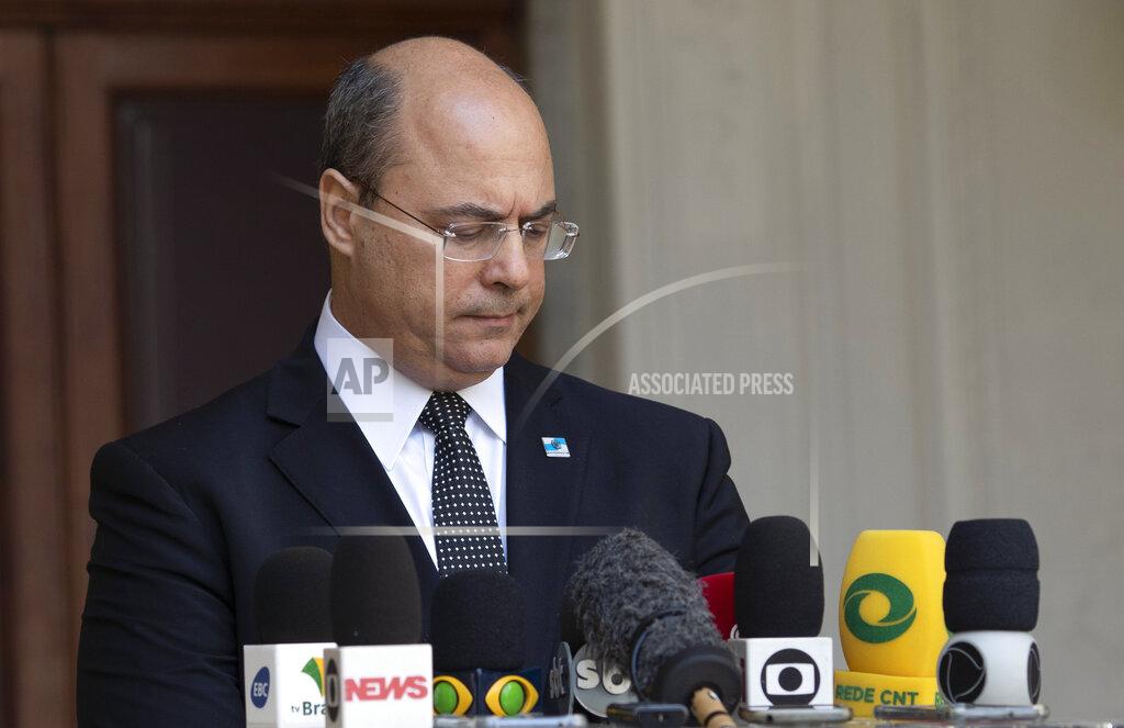 Silvia Izquierdo Rio de Janeiro Governor Wilson Witzel pauses as he speaks to journalists at the Laranjerias palace in Rio de Janeiro, Brazil, Tuesday, May 26, 2020. Brazil's Federal Police searched Witzel's official residence on Tuesday, part of an investigation into the alleged embezzlement of public resources in the state's response to the COVID-19 pandemic. (AP Photo/Silvia Izquierdo)