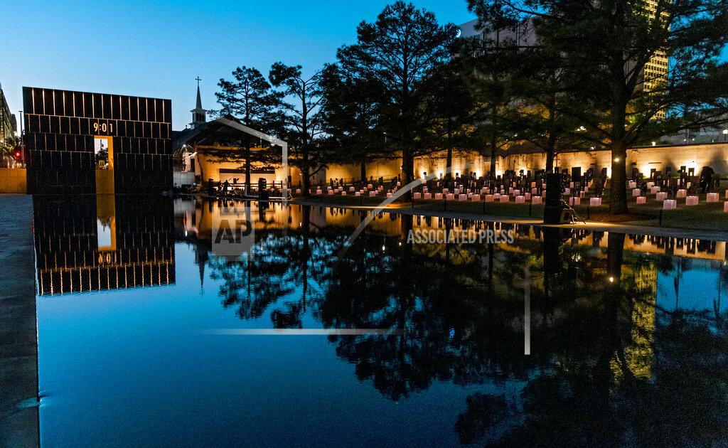 Chris Landsberger The 9:01 gate is lit during the 26th Anniversary Remembrance Ceremony at the Oklahoma City National Memorial and Museum in Oklahoma City, Okla on Monday, April 19, 2021. (Chris Landsberger/The Oklahoman via AP)
